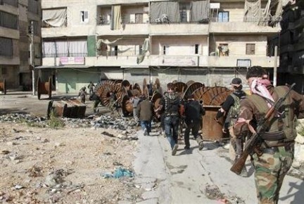 En calles y edificios de Jdeidet al-Fadel se están hallando más cuerpos quemados o ejecutados en forma sumaria.