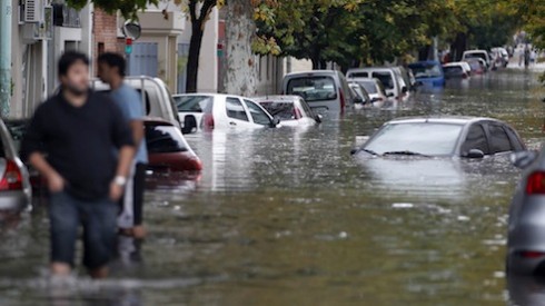 Submerged cars are seen in a flooded street after a rainstorm in Buenos Aires