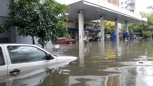 Submerged cars in a flooded gas station are seen after a rainstorm in Buenos Aires