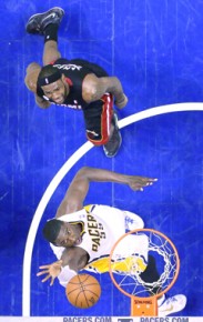 *Indiana Pacers' Roy Hibbert puts up a shot as Miami Heat's LeBron James--AP Photo-Michael Conroy