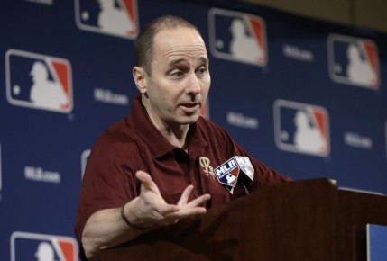 *New York Yankees general manager Brian Cashman answers questions concerning third baseman Alex Rodrigue--AP Photo-Mark Humphrey