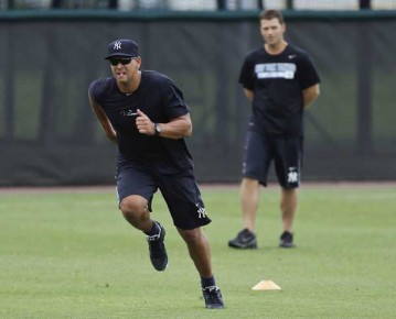 *New York Yankees third baseman Alex Rodriguez runs under the supervision of trainer Mike Wickland--AP Photo-Chris O'Meara