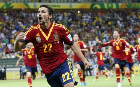 Spain's Jesus Navas celebrates after scoring his side winning penalty against:AP Photo:Eugene Hoshiko