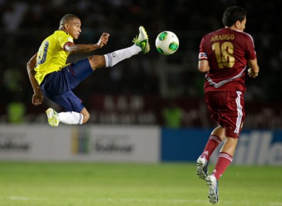 *Colombia's Macnelly Torres, left, jumps to control the ball as Venezuela's Juan Arango--AP Photo-Fernando Llano