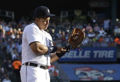 *Detroit Tigers third baseman Miguel Cabrera adjusts his glove during the first inning--AP Photo-Carlos Osorio