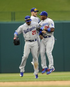 Los Angeles Dodgers' Carl Crawford (25), Skip Schumaker, back center, and Yasiel Puig::AP Photo:Nick Wass