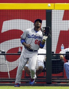 *Los Angeles Dodgers right fielder Yasiel Puig (66) makes the catch in the first inning--AP Photo-Rick Scuteri