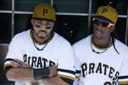 *Pittsburgh Pirates' Pedro Alvarez, left, and Andrew McCutchen sit in the dugout before--AP Photo-Gene J. Puskar