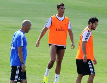 *Real Madrid's French assistant coach Zinedine Zidane, Real Madrid's Portuguese forward Cristiano Ronaldo--AFP PHOTO - DOMINIQUE FAGET