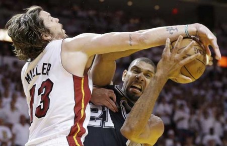 *San Antonio Spurs power forward Tim Duncan (21) works as Miami Heat shooting--AP Photo-Lynne Sladky