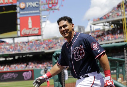 *Washington Nationals Wilson Ramos comes out of the dugout to acknowledge--AP Photo-Alex Brandon