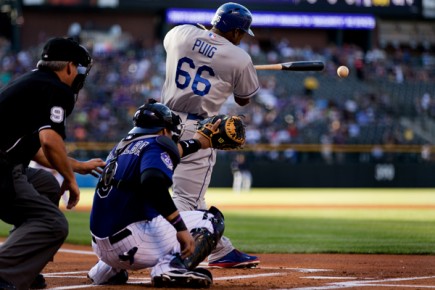 *Yasiel Puig #66 of the Los Angeles Dodgers singles during the first inning--Justin Edmonds-Getty Images-AFP