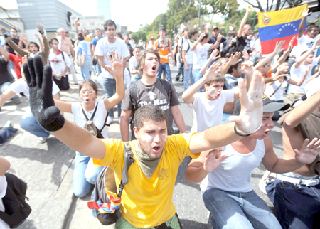 Students shout slogans during a protest