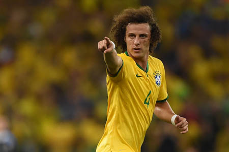 Brazil's defender David Luiz celebrates after scoring the quarter-final football::AFP PHOTO : EITAN ABRAMOVICH