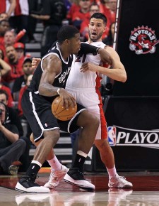 Joe Johnson #7 of the Brooklyn Nets tries to get by a defending Greivis Vasquez::Claus Andersen:Getty Images:AFP