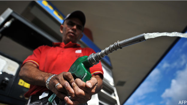 An employee of a gas station in Caracas,