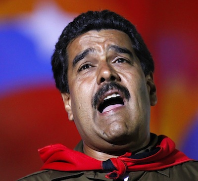 Venezuela's presidential candidate Nicolas Maduro sings during a campaign rally in Caracas