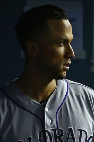 Carlos Gonzalez #5 of the Colorado Rockies looks on from the dugout::Victor Decolongon:Getty Images:AFP