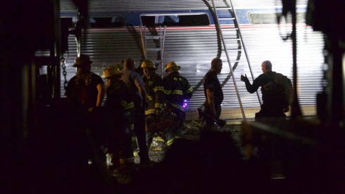 PHILADELPHIA, PA - MAY 12:  Emergency workers search for the injured after an Amtrak passenger train carrying more than 200 passengers from Washington, DC to New York derailed May 12, 2015 in north Philadelphia, Pennsylvania. At least five people were killed and more than 50 others were injured in the crash.  (Photo by Mark Makela/Getty Images)