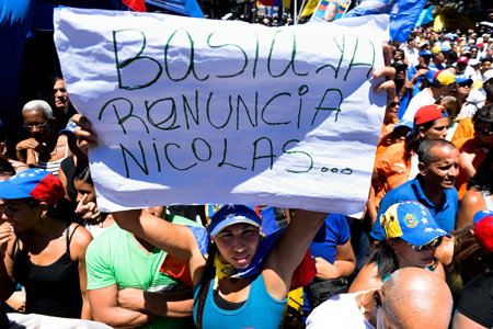 Opponents of Venezuelan government take part in a demonstration demanding::AFP PHOTO : FEDERICO PARRA