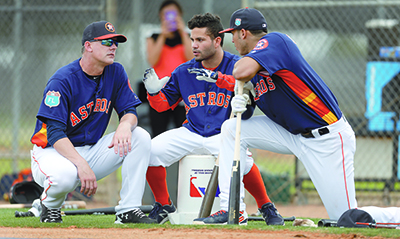 FILE - In this Feb. 23, 2016, file photo, Houston Astros manager A.J. Hinch, left, and Astros' Jose Altuve and Carlos Correa chat during a workout at the Astros spring training camp in Kissimmee, Fla. Altuve is one of only a handful of remaining Astros who endured the team's rebuilding project. (Karen Warren/Houston Chronicle via AP, File) MANDATORY CREDIT