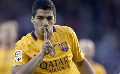 Barcelona's Uruguayan forward Luis Suarez celebrates after scoring a goal during the Spanish league football match RC Deportivo de la Coruna vs FC Barcelona at the Municipal de Riazor stadium in La Coruna on April 20, 2016. Barcelona won the match 8-0. / AFP PHOTO / MIGUEL RIOPA