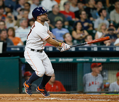 HOUSTON, TX - JUNE 20: Jose Altuve #27 of the Houston Astros hits a home run in the fourth inning against the Los Angeles Angels of Anaheim at Minute Maid Park on June 20, 2016 in Houston, Texas.   Bob Levey/Getty Images/AFP