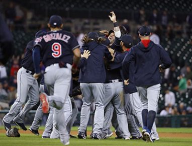 Cleveland Indians' Jason Kipnis celebrates with teammates after the Indians defeated the Detroit Tigers 7-4 in a baseball game in Detroit, Monday, Sept. 26, 2016. The Indians clinched the AL Central. (AP Photo/Paul Sancya)