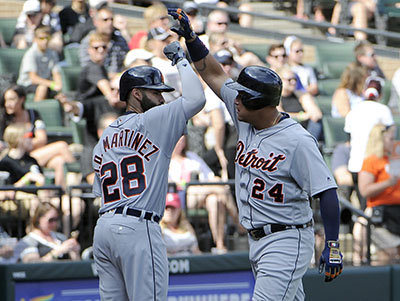 CHICAGO, IL - SEPTEMBER 05: Miguel Cabrera #24 of the Detroit Tigers is greeted by J.D. Martinez #28 after hitting a home run against the Chicago White Sox during the first inning on September 5, 2016 at U. S. Cellular Field in Chicago, Illinois.   David Banks/Getty Images/AFP