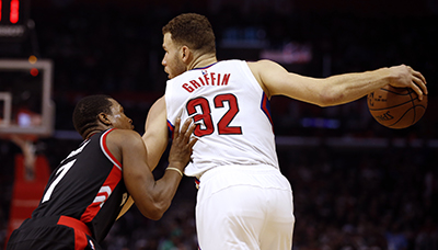 Los Angeles Clippers forward Blake Griffin (32) keeps the ball away from Toronto Raptors guard Kyle Lowry, left, during the first half of an NBA basketball game in Los Angeles, Monday, Nov. 21, 2016. (AP Photo/Alex Gallardo)