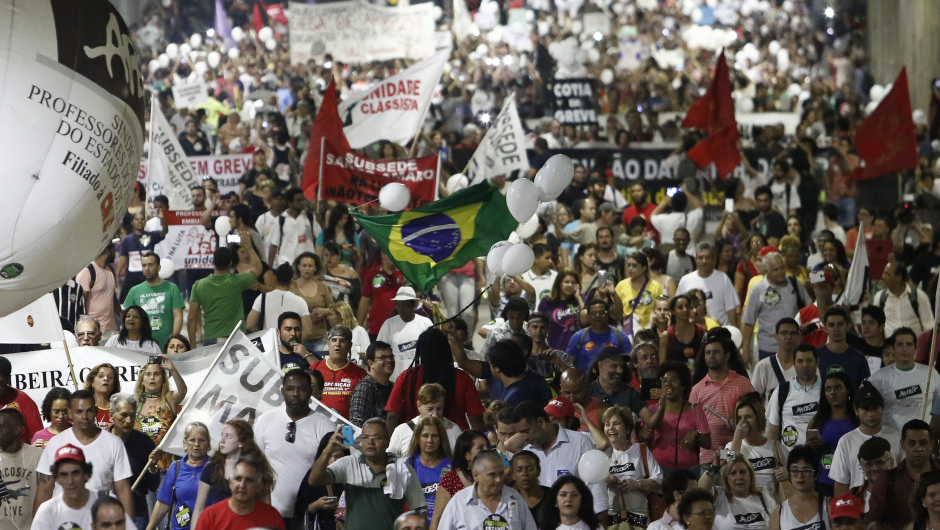 State teachers march in protest in Sao Paulo, Brazil, on April 17, 2015 demanding a pay rise. AFP PHOTO / MIGUEL SCHINCARIOL        (Photo credit should read Miguel Schincariol/AFP/Getty Images)