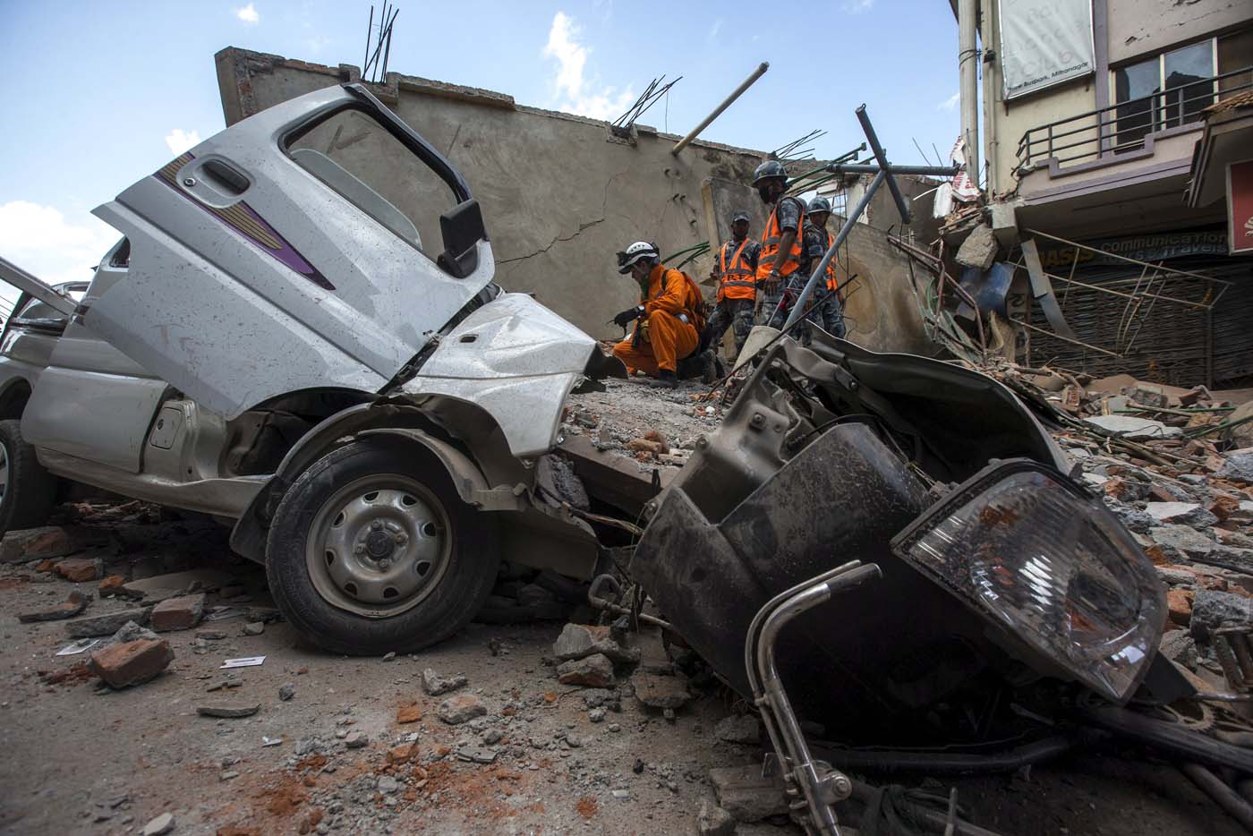 Nepalese military personnel stands on a collapsed building after earthquake in centre of Kathmandu, Nepal, May 12, 2015. REUTERS/Athit Perawongmetha