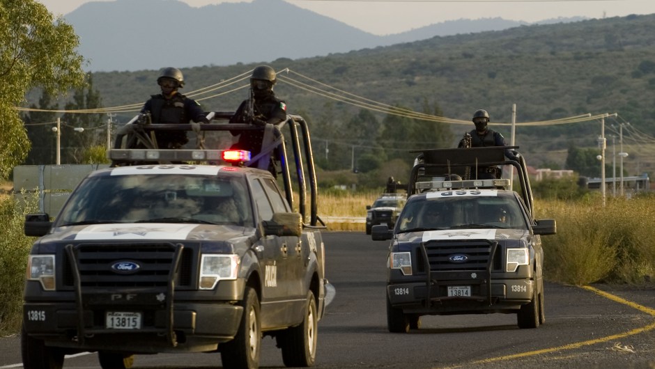 Federal Policemen patrol the streets during the state election in Numaran Municipality, Michoacan, Mexico, on November 13, 2011. AFP PHOTO/Alfredo ESTRELLA (Photo credit should read ALFREDO ESTRELLA/AFP/Getty Images)