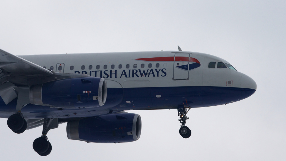 A British Airways plane flies in to land at Heathrow airport in west London on January 21, 2013 after the airport announced further flight cancellations due to adverse weather. London's Heathrow Airport warned of further flight cancellations on January 21 which would leave thousands more passengers stranded on the fourth day of delays after heavy snow swept across Britain. AFP PHOTO/ANDREW COWIE        (Photo credit should read ANDREW COWIE/AFP/Getty Images)