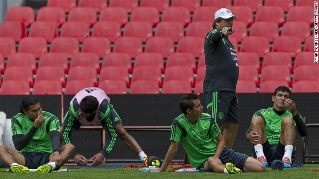 Mexican national football team team coach Miguel Herrera (2nd R) talks to his players during a training session on November 12, 2013 in Mexico City. Mexico will face New Zealand in Mexico City next November 13 in a playoff qualifier match for the FIFA World Cup Brazil 2014. AFP PHOTO/OMAR TORRESOMAR TORRES/AFP/Getty Images