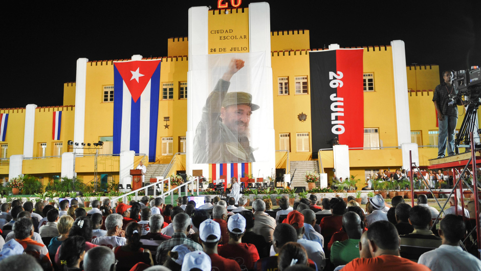 Picture taken during the celebrations for the 62nd anniversary of the guerrilla assault on the Moncada Barracks, widely regarded as the beginning of the Cuban Revolution, in Santiago de Cuba, on July 26, 2015. More than 100 rebels led by Fidel Castro attempted to storm the military facility at Moncada on July 26, 1953, in the first armed action of the revolution to topple dictator Fulgencio Batista. The assault ended in a crushing defeat for the rebels, with many killed, while Fidel and Raul Castro were captured and imprisoned.   AFP PHOTO / YAMIL LAGE        (Photo credit should read YAMIL LAGE/AFP/Getty Images)