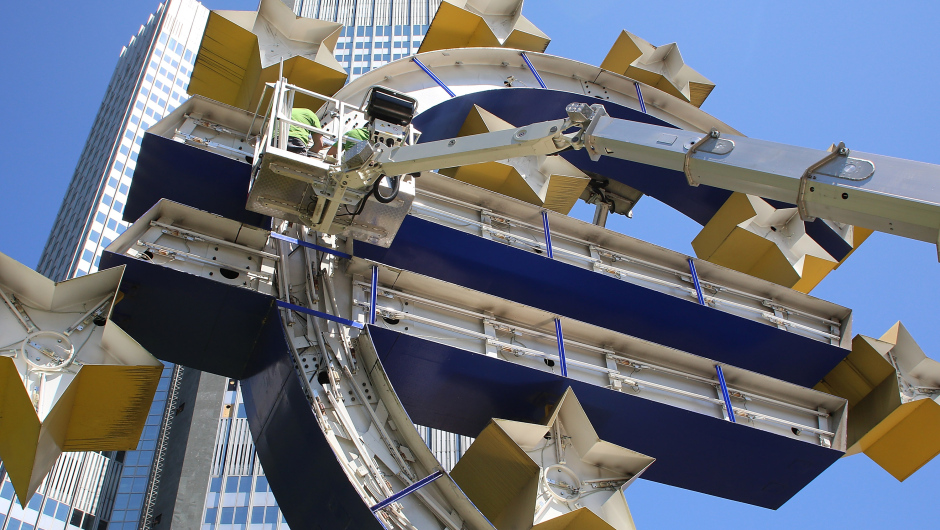 FRANKFURT, GERMANY - JULY 06:  The Euro sculpture, near the old ECB headquarters, undergoes maintenance on July 6, 2015 in Frankfurt, Germany. The DAX dropped slightly in the morning though investors remain cautious as the consequences of the referendum remain uncertain. Greeks voted in a strong majority against the reform plan proposed by the troika of the European Central Bank, the International Monetary Fund and the European Commission in a move that many fear will lead to a departure by Greece from the Eurozone.  (Photo by Hannelore Foerster/Getty Images)