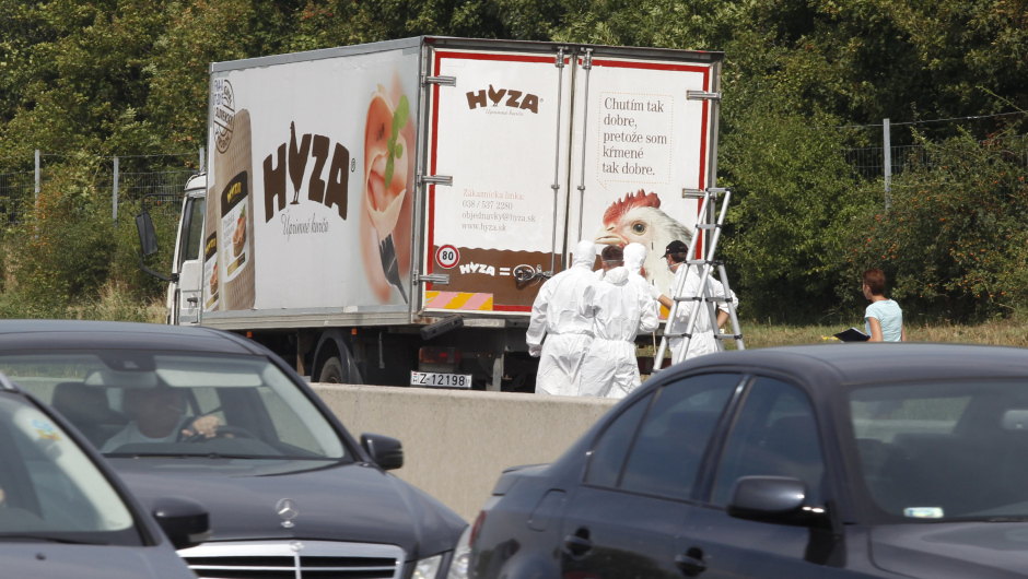 Forensic officers stand in front of a truck inside which where found a large number of dead migrants on a motorway near Neusiedl am See, Austria, on August 27, 2015. The vehicle, which contained between 20 and 50 bodies, was found on a parking strip off the highway in Burgenland state, police spokesman Hans Peter Doskozil said at a  press conference with Interior Minister Johanna Mikl-Leitner. AFP PHOTO / DIETER NAGL        (Photo credit should read DIETER NAGL/AFP/Getty Images)