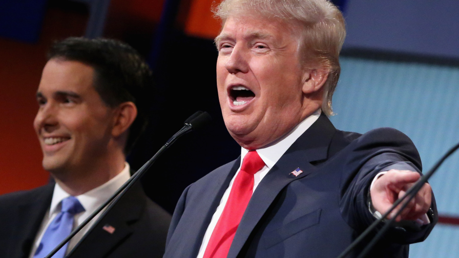 CLEVELAND, OH - AUGUST 06:  Republican presidential candidates Donald Trump (R) and Wisconsin Gov. Scott Walker participate in the first prime-time presidential debate hosted by FOX News and Facebook at the Quicken Loans Arena August 6, 2015 in Cleveland, Ohio. The top-ten GOP candidates were selected to participate in the debate based on their rank in an average of the five most recent national political polls.  (Photo by Chip Somodevilla/Getty Images)