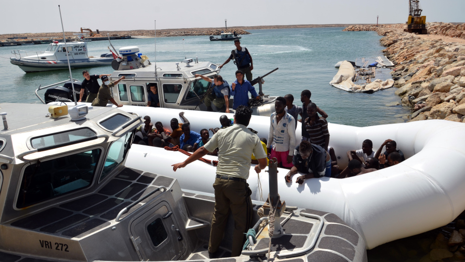 Migrants arrive at the El-Kitif port in the Tunisian town of Ben Guerdane, some 40 kilometres west of the Libyan border, following their rescue by Tunisia's coastguard and navy after their vessel overturned off Libya, on August 23, 2015. 125 migrants, including 28 women, were rescued from two boats which broke down as they headed from Libya to Italy, an AFP photographer said. AFP PHOTO / FETHI NASRI        (Photo credit should read FETHI NASRI/AFP/Getty Images)