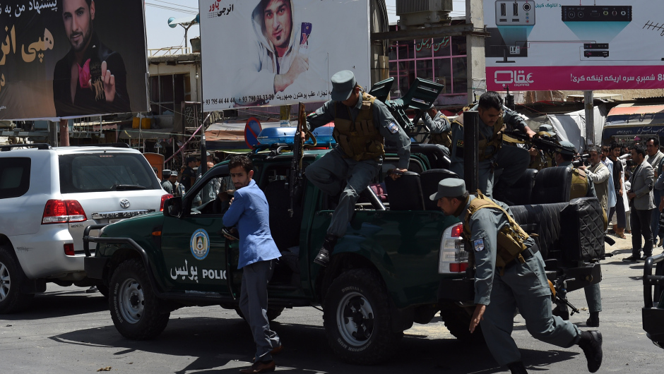 Afghan police personnel arrive at the site of a bomb attack near the entrance to Kabul's international airport in Kabul on August 10, 2015. A huge blast struck near the entrance of Kabul's international airport on August 10 during the peak lunchtime period, officials said, warning that heavy casualties were expected. "The explosion occurred at the first check point of Kabul airport," said deputy Kabul police chief Sayed Gul Agha Rouhani. AFP PHOTO / Wakil Kohsar        (Photo credit should read WAKIL KOHSAR/AFP/Getty Images)