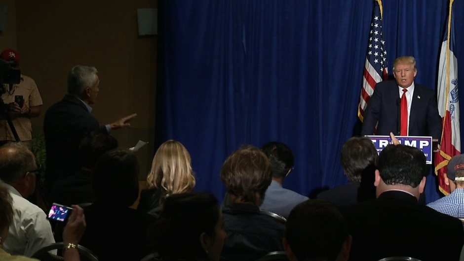 A member of security for presidential candidate Donald Trump escorted Univision anchor Jorge Ramos from a press conference in Dubuque, Iowa on Tuesday, August 25, 2015. Trump told Ramos to "go back to Univsion" after Ramos repeatedly tried to ask a question bout immigration.