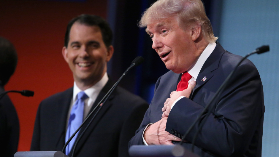 CLEVELAND, OH - AUGUST 06:  Republican presidential candidates Donald Trump (R) and Wisconsin Gov. Scott Walker participate in the first prime-time presidential debate hosted by FOX News and Facebook at the Quicken Loans Arena August 6, 2015 in Cleveland, Ohio. The top-ten GOP candidates were selected to participate in the debate based on their rank in an average of the five most recent national political polls.  (Photo by Chip Somodevilla/Getty Images)