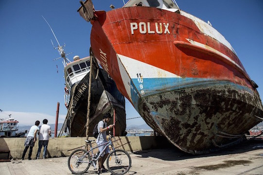 TOPSHOTS
Fishing boats that were ran aground by the sea while berthed in the port of Coquimbo, some 445 km north of Santiago, during the eve's earthquake on September 17, 2015. A million people were evacuated in Chile after an 8.3-magnitude quake struck offshore in the Pacific, killing at least 10 people and triggering tsunami waves along its northern coast. AFP PHOTO /MARTIN BERNETTI