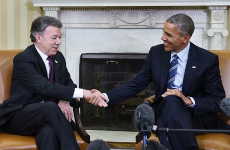 Santos fue recibido por Obama en la Casa Blanca para conmemorar los 15 años del "Plan Colombia".
AFP / MANDEL NGAN