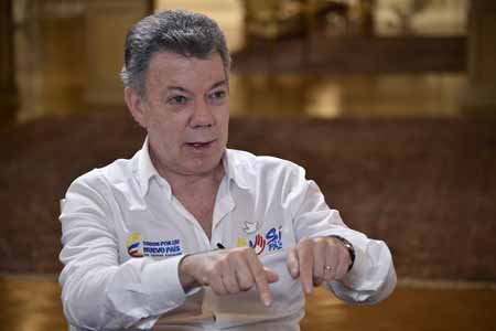 “La misión de estos 1.500 miembros de las fuerzas militares junto a otros 2.500 policías, será la construcción y la conservación de la paz en Colombia”, destacó el presidente Juan Manuel Santos.
GUILLERMO LEGARIA / AFP