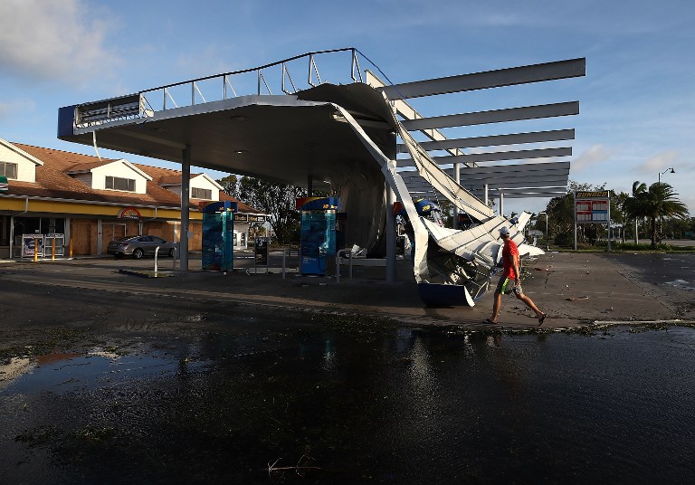 BONITA SPRINGS, FL - SEPTEMBER 11: The roof of a gas station is shown damaged by Hurricane Irma winds on September 11, 2017 in Bonita Springs, Florida. Yesterday Hurricane Irma hit Florida's west coast leaving widespread damage and flooding.   Mark Wilson/Getty Images/AFP