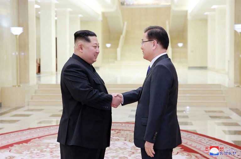 This picture taken on March 5, 2018 and released from North Korea's official Korean Central News Agency (KCNA) on March 6, 2018 shows North Korean leader Kim Jong-Un (L) shaking hands with South Korean chief delegator Chung Eui-yong (R), who travelled as envoys of the South's President Moon Jae-in, during their meeting in Pyongyang.North Korean leader Kim Jong Un discussed ways to ease tensions on the peninsula with visiting South Korean envoys, the state KCNA news agency reported on March 6. / AFP PHOTO / KCNA VIA KNS / STR / / AFP PHOTO / KCNA VIA KNS / STR / SOUTH KOREA OUT / REPUBLIC OF KOREA OUT   ---EDITORS NOTE--- RESTRICTED TO EDITORIAL USE - MANDATORY CREDIT "AFP PHOTO/KCNA VIA KNS" - NO MARKETING NO ADVERTISING CAMPAIGNS - DISTRIBUTED AS A SERVICE TO CLIENTS