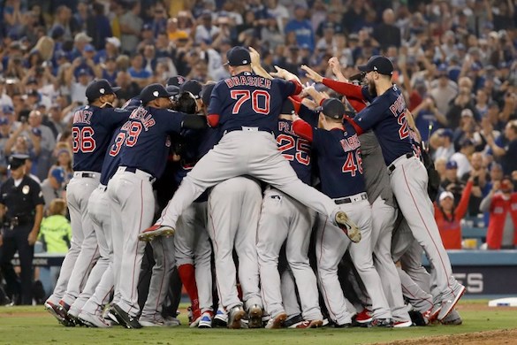 LOS ANGELES, CA - OCTOBER 28: The Boston Red Sox celebrate their 5-1 win over the Los Angeles Dodgers in Game Five to win the 2018 World Series at Dodger Stadium on October 28, 2018 in Los Angeles, California.   Sean M. Haffey/Getty Images/AFP