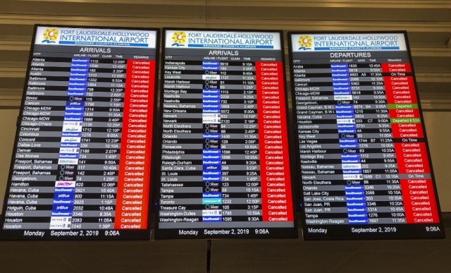 The information board displays all the cancelled flights at the Fort Lauderdale International airport ahead of the arrival of hurricane Dorian at ForT Lauderdale, Florida on September 2, 2019. - Hurricane Dorian battered the Bahamas with ferocious wind and rain, the monstrous Category 5 storm wrecking towns and homes as it churned on an uncertain path toward the US coast where hundreds of thousands were ordered to evacuate. (Photo by Michele Eve SANDBERG / AFP)